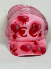 Load image into Gallery viewer, cc heart eyes hat by jimmy guiterrez